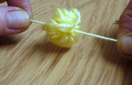 Yarn Flower Hair Clip - knotted yarn