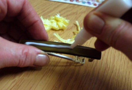 Yarn Flower Hair Clip - begin gluing the three flowers to a hair clip