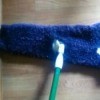 sweater arm as reusable dust mop cover