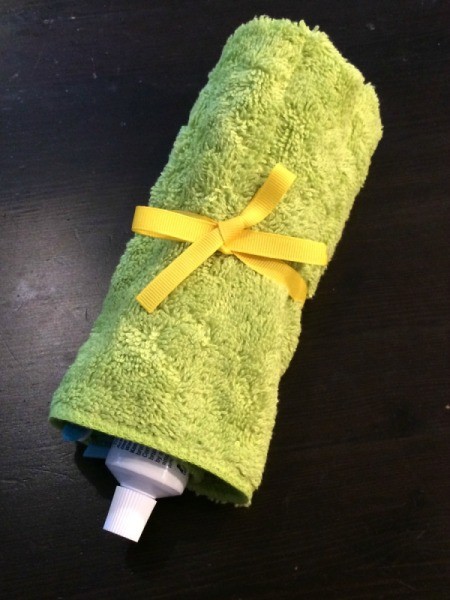 Washcloth Travel Toothbrush Holder - holder rolled and tied closed with ribbon