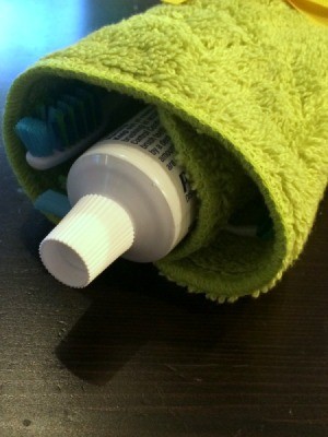 Washcloth Travel Toothbrush Holder - with toothpaste tube showing
