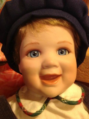 closeup of boy doll with cap