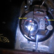 A bobbin in a Singer sewing machine.