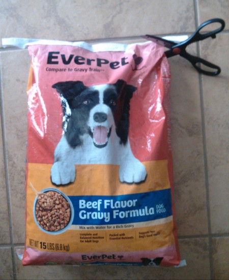 cutting off top of bag to empty before making tote from dog food bag