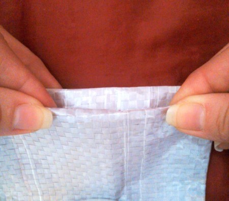 turn under the top edge of the bag
