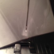 Threading Sewing Machine Needles  - piece of white paper behind sewing machine needle