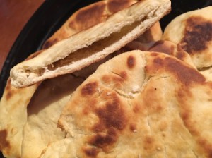 A plate of homemade pita rounds.