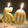 50th birthday party numbered candles on a cake