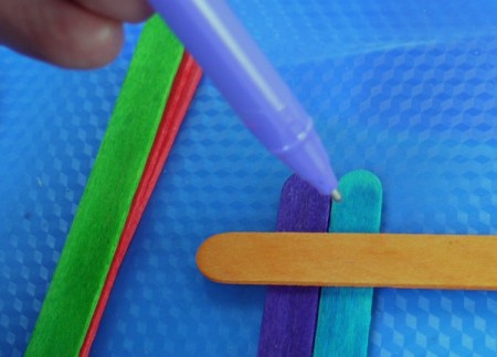 marking the placement of the orange sticks