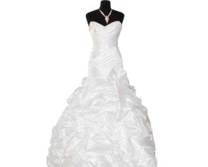 White wedding dress on black dress form against white background