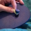 A rubber band around the center thong of a flip flop.