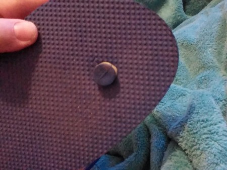 A rubber band around the center thong of a flip flop.