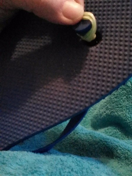 A rubber band around the center thong of a flip flop.