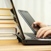 A student using a computer and tablet.