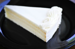 A slice of white chocolate cake.