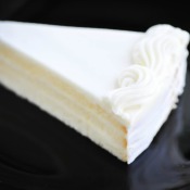 A slice of white chocolate cake.