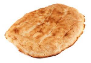 Single piece of flat bread against a white background