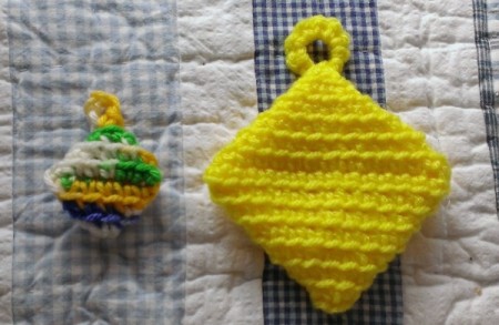 two small crochet hot pad magnets