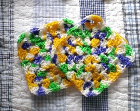 Two crocheted hot pads.