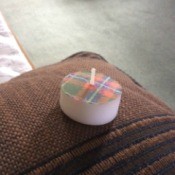 Tea light with plaid cover