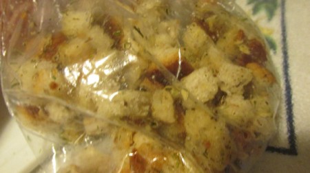 Best Homemade Croutons - adding spices to the bread