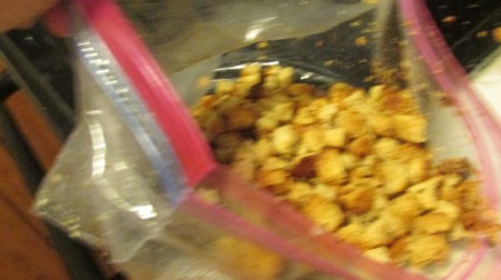 Best Homemade Croutons - adding spices to the bread