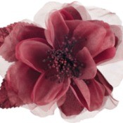 A single maroon fabric flower against a white background