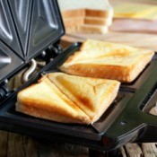 Sandwich toaster with toasted sandwich