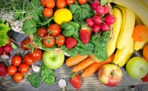 Wide assortment of fruits and vegetables spread out on a table