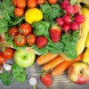 Wide assortment of fruits and vegetables spread out on a table