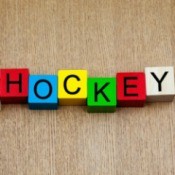Blocks spelling out "I [heart] HOCKEY" against wood background
