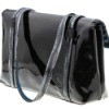 Black patent leather purse against a white background