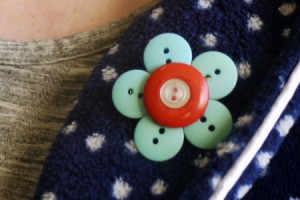 button brooch on collar