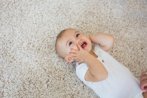 Baby on carpet.