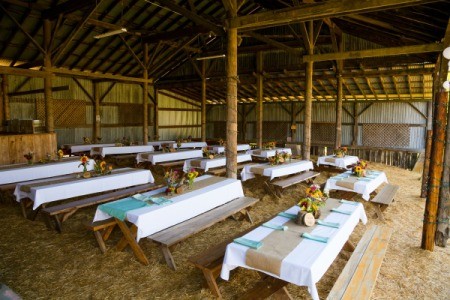 A barn decorated for a wedding reception.