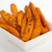 White dish with Sweet Potato Fries against a white background