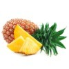 Whole fresh pineapple laying on it's size with fresh pineapple slices