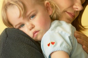 Mother soothing a toddler age girl.