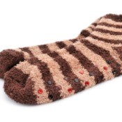 A pair of fuzzy socks with rubber dots on the bottom to help stop slipping
