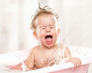 Toddler yelling and splashing in bath