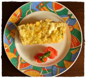 A slice of corn and sweet basil savory bread.