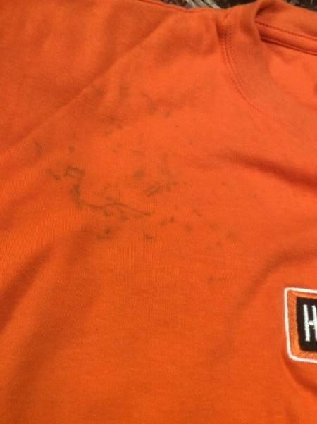 dye spots on orange shirt