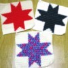Crocheted squares with different colored stars.