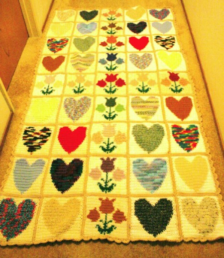 rectangular finished crochet project made of up hearts and tulip blocks