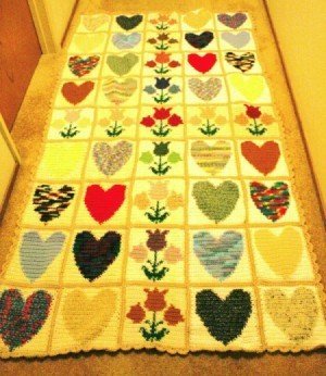 rectangular finished crochet project made of up hearts and tulip blocks