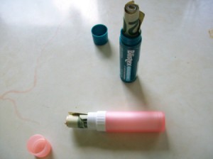 roll of money inside Chapstick containers