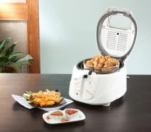 Home Deep Fryer with Fried chicken and chicken and sauces on table