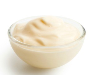 Bowl of mayonnaise based dip in clear glass bowl