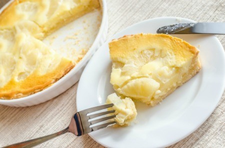 Slice of Pineapple cheesecake with fork.