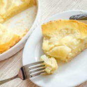 Slice of Pineapple cheesecake with fork.